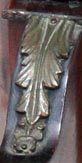 Brass leaves ornament on the tripod tilt-top table legs