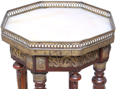 The top the Plant Stand is made of cream and honey marble surrounded by a pierced gilt brass gallery
