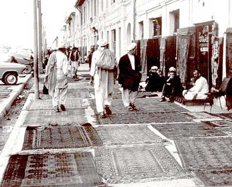 Oriental Carpets & Rugs - Laying carpets in the sun